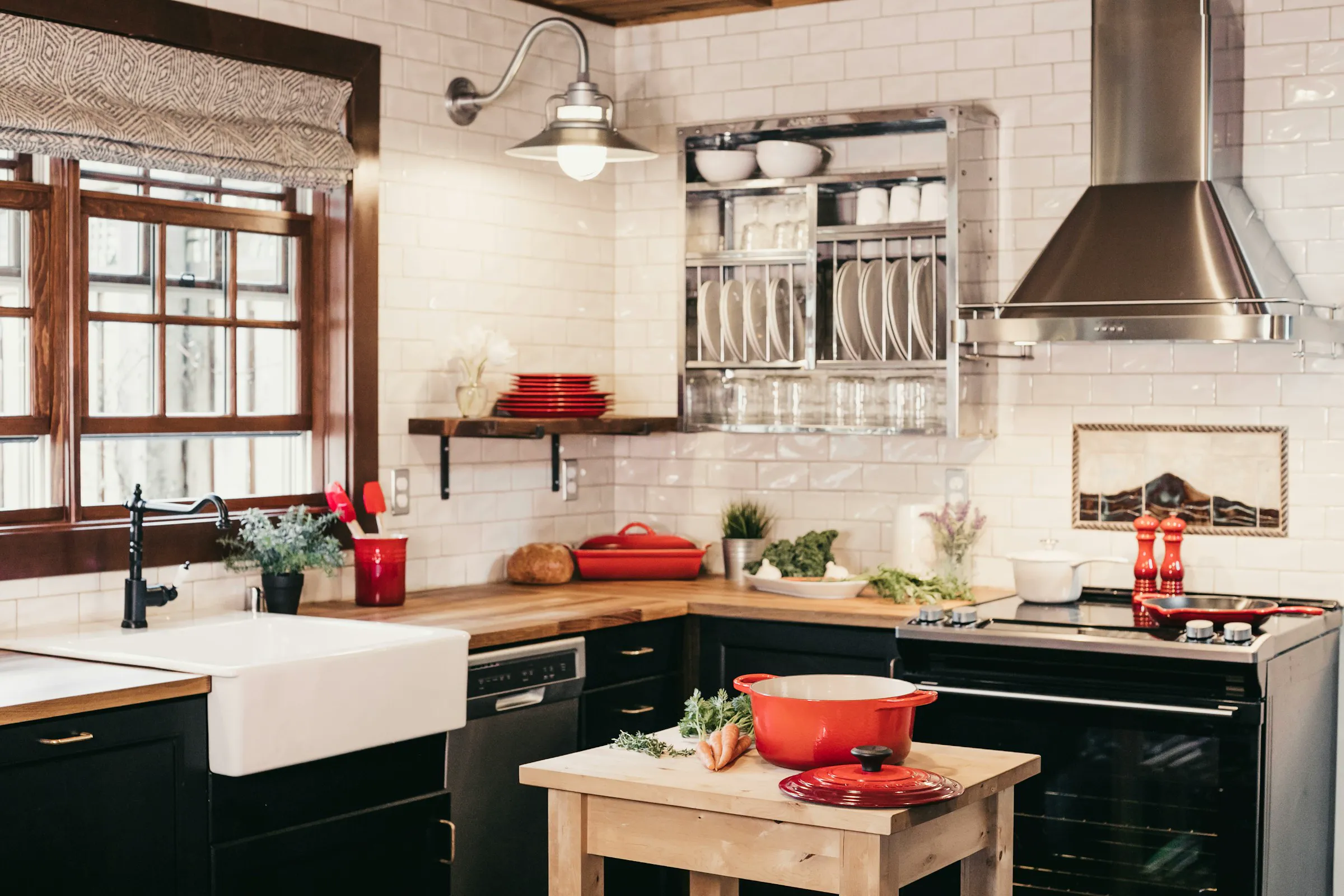 Farmhouse kitchen with a farmhouse sink, subway tile, and wood counters